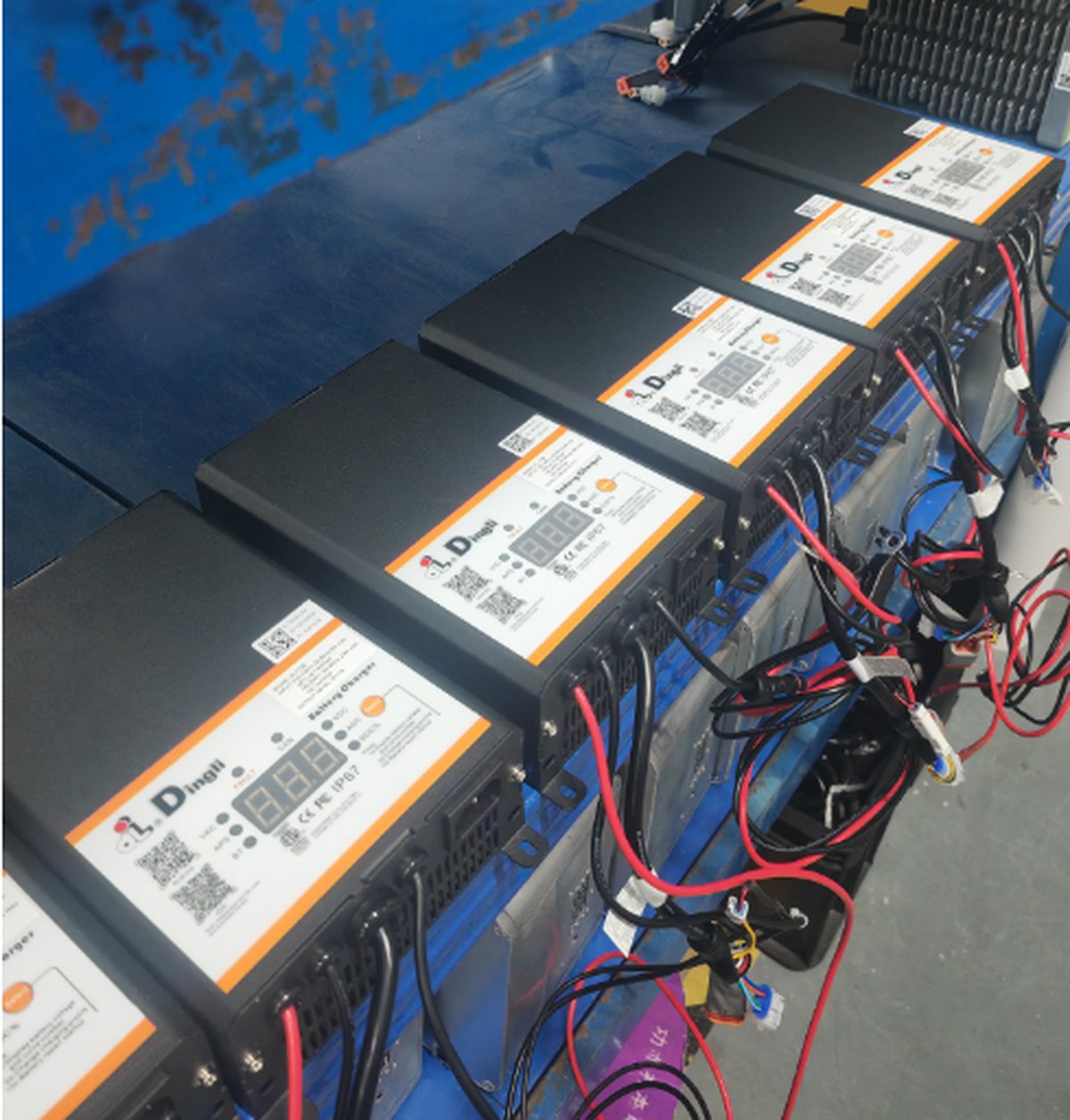 Dingli battery packs staged on the production line ready for charger pairing