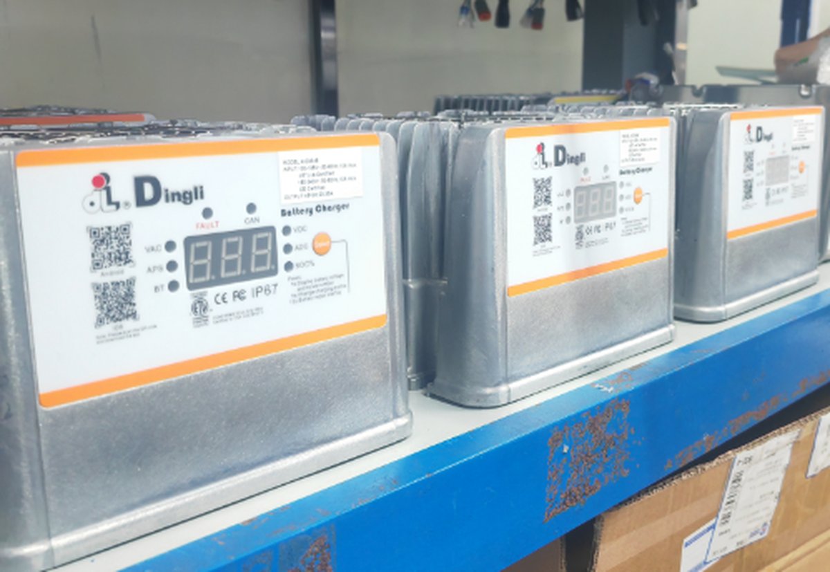 Row of ALT-700 chargers on Dingli's mast-lift assembly line