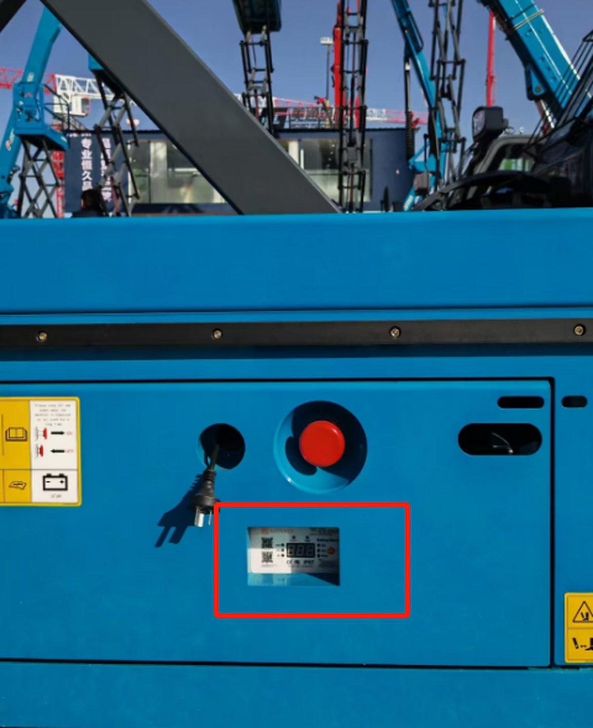 ALT-1700RC custom-spec charger fitted into the side compartment of a Chinese aerial work platform on a job site.