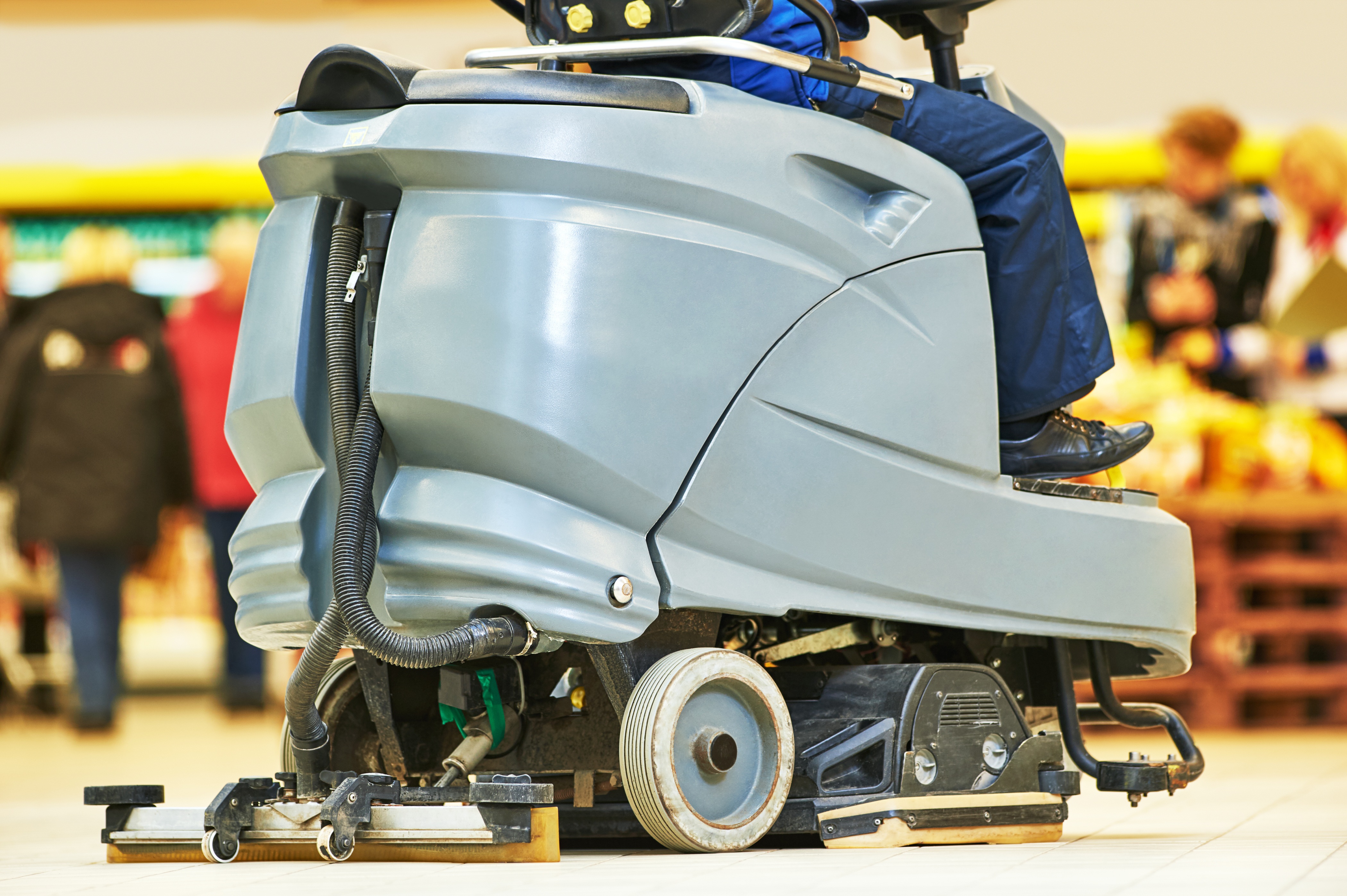 Ride-on floor scrubber in commercial environment