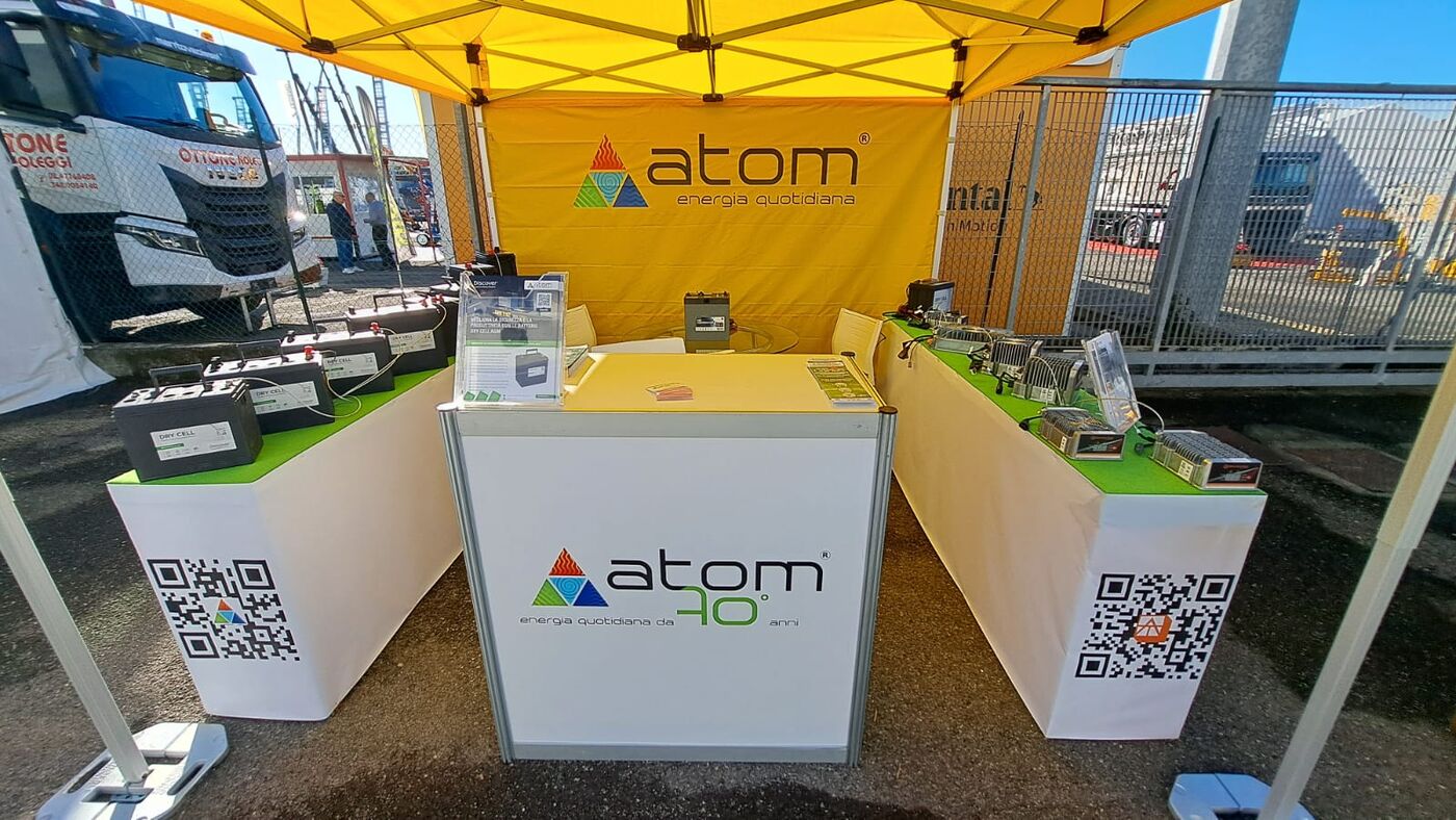 Atom partner booth with Alternative Track chargers on display
