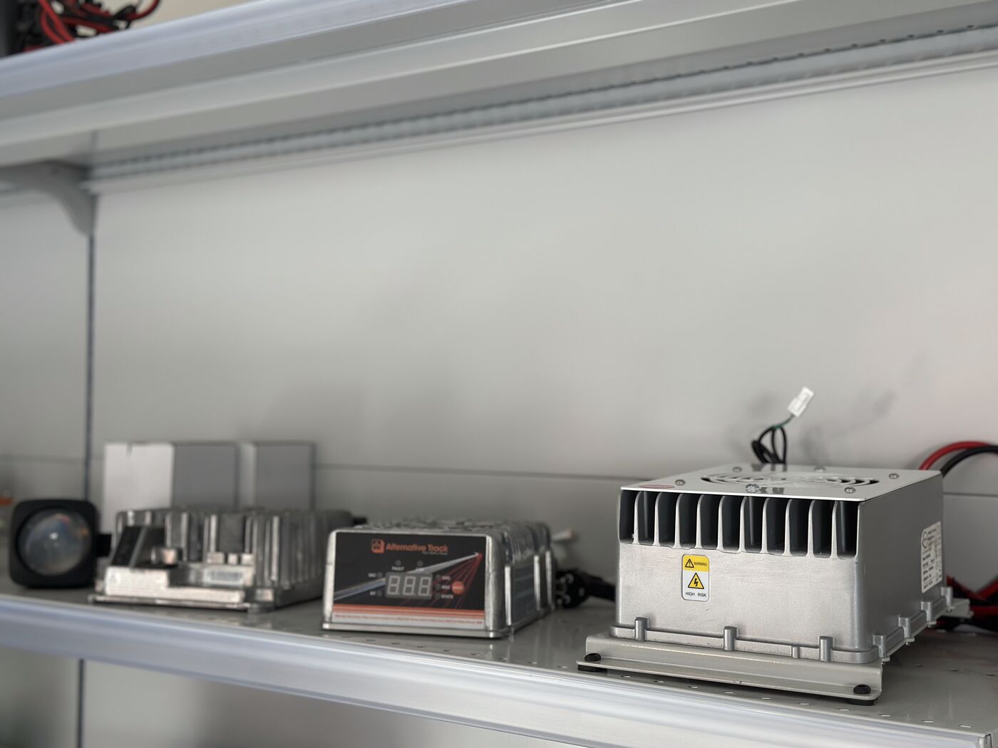 Showroom shelves with ALT chargers across battery options